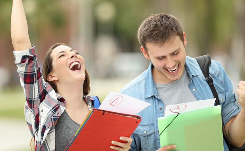 Two students happy after receiving top grades