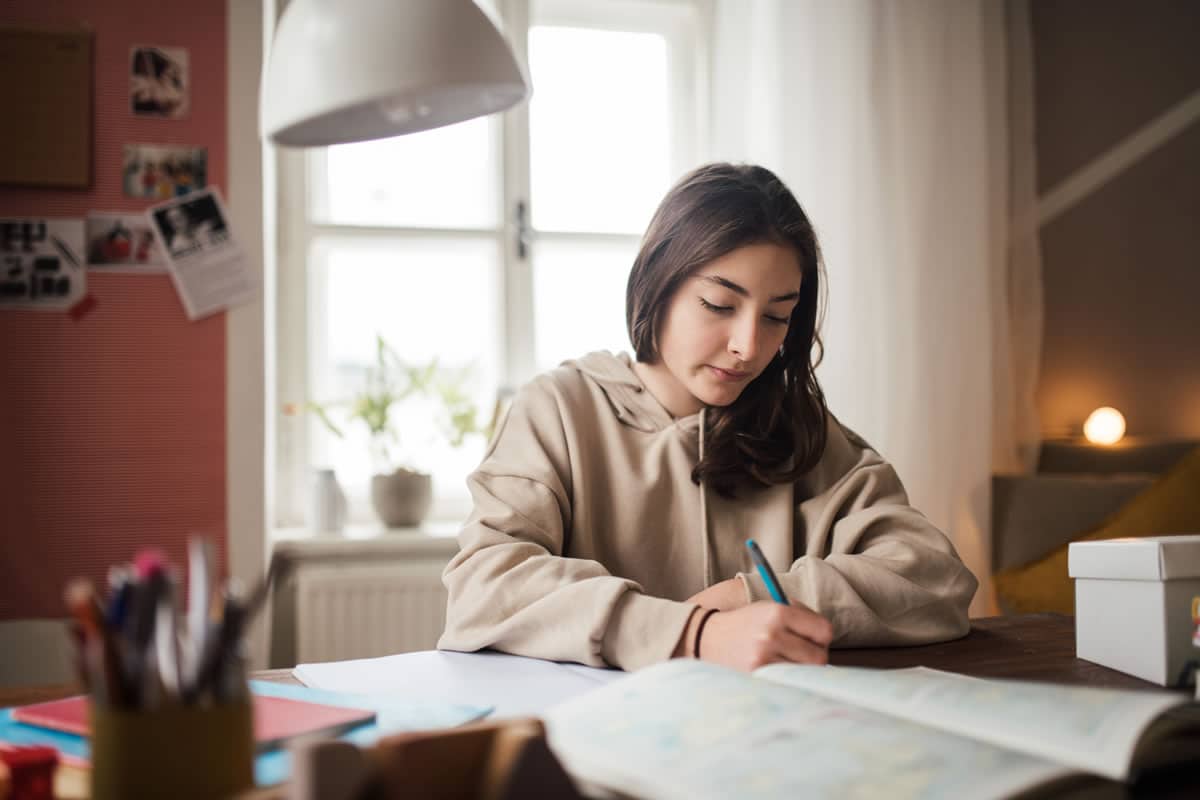 A young female student studying for an exam